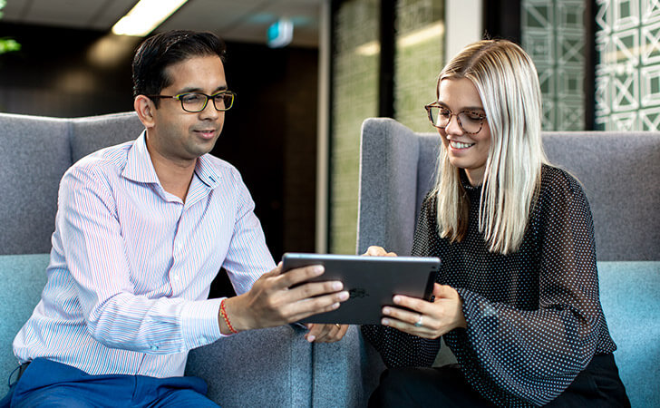 Workmates reading intern stories