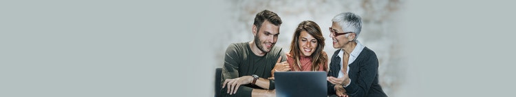 Team looking in laptop